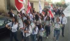 بلدية رأس بعلبك وكاريتاس نظمتا مسيرة دعما للجيش والمقاومة في البلدة