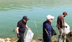 مصلحة الليطاني  نظمت يوما بيئيا لتنظيف ضفاف بحيرة القرعون