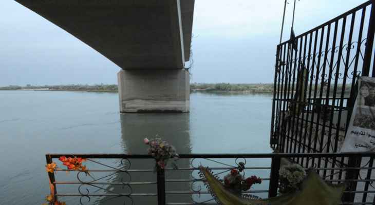 إنقاذ امرأة من الانتحار على جسر تكريت في العراق
