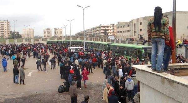 خروج 700 من المسلّحين وعائلاتهم من حي الوعر في حمص باتجاه محافظة إدلب