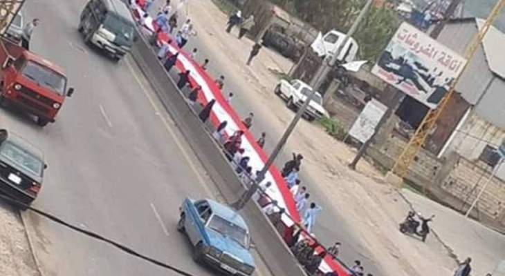 كشاف الجراح مفوضية المنية نفذ أطول علم لبناني في العالم