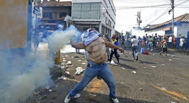 المتظاهرون في كولومبيا يضرمون النار في قصر العدل غربي البلاد